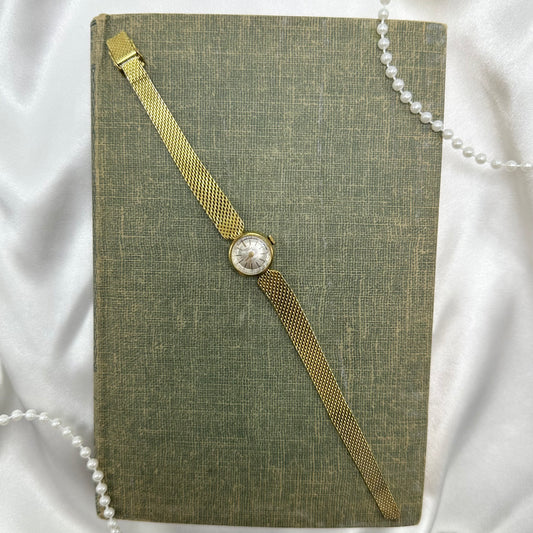 Dainty gold tone Germinal Voltaire manual winding watch. 17 jewels.
