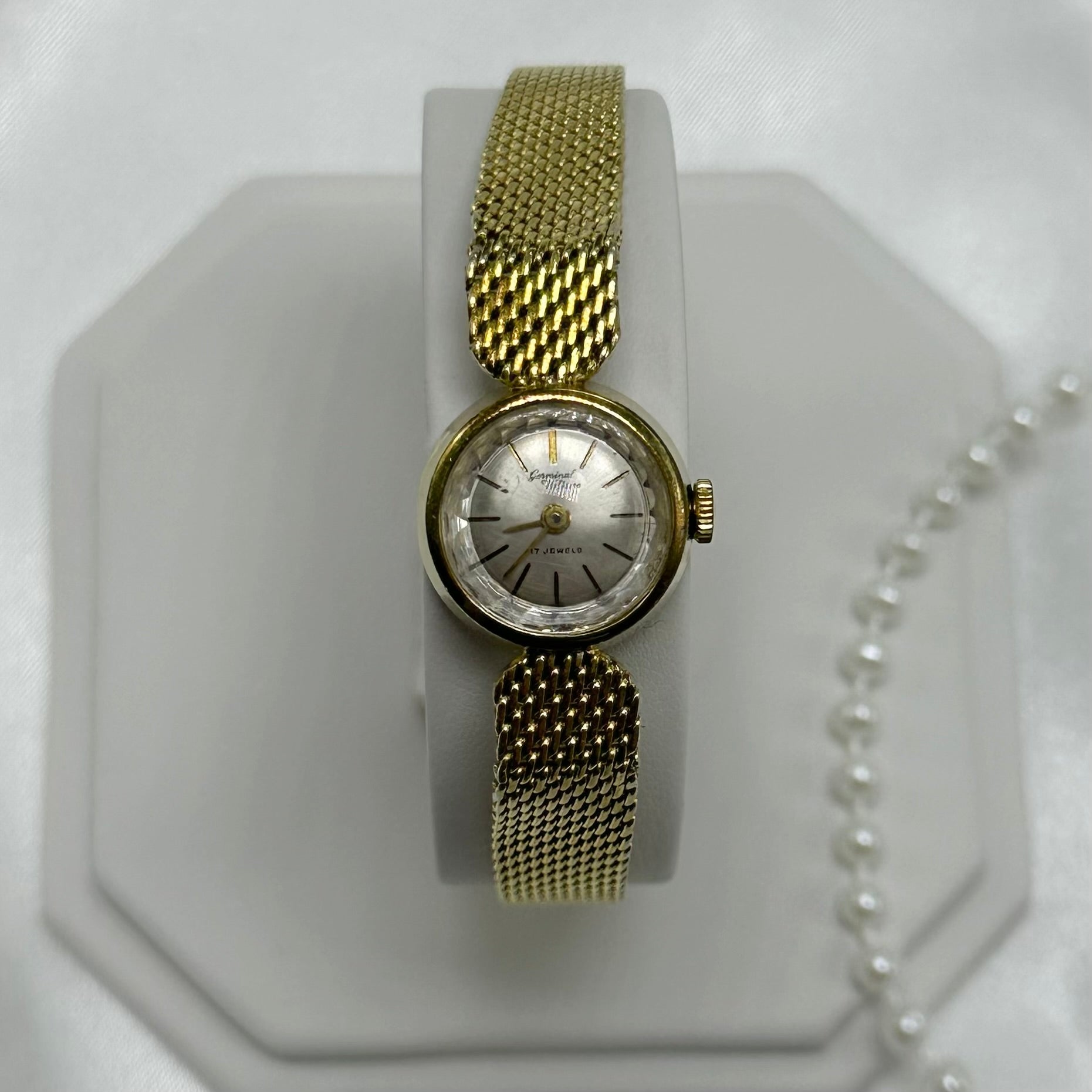 Dainty gold tone Germinal Voltaire manual winding watch