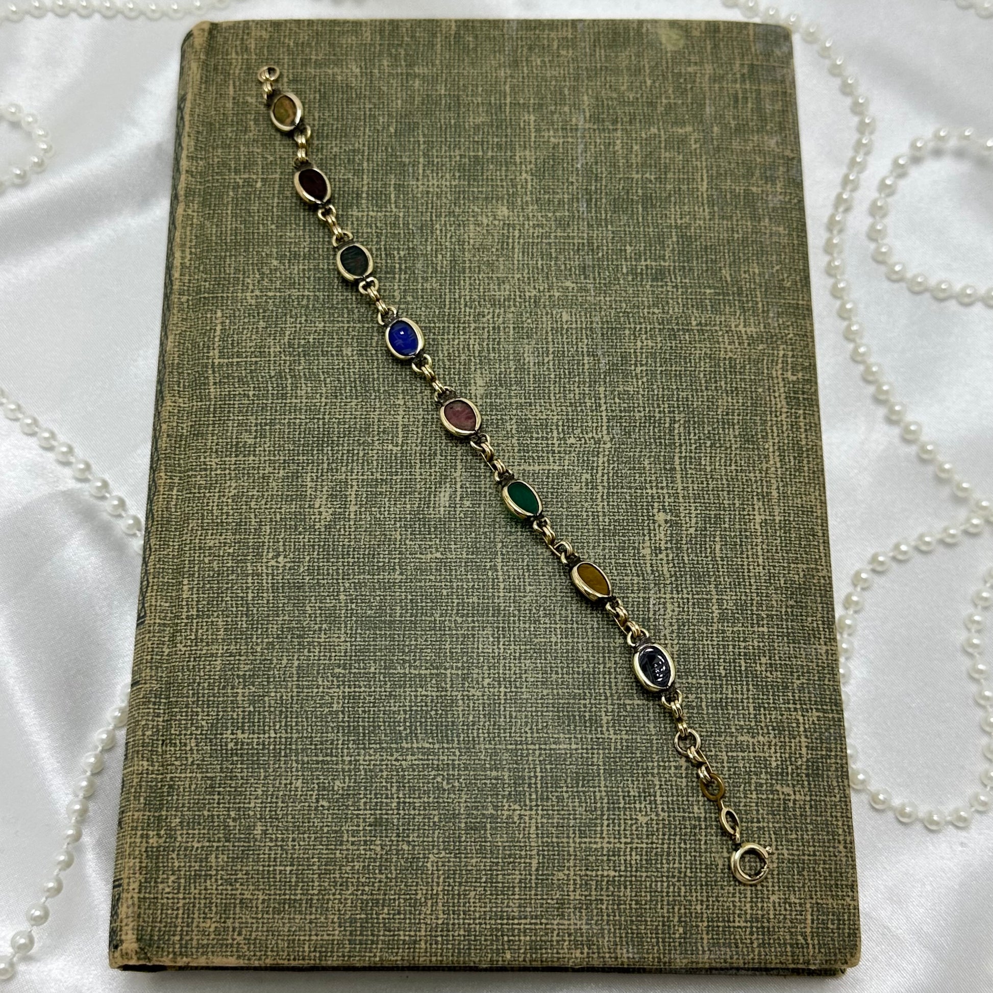 Dainty vintage gold tone bracelet with multicolor scarabs.