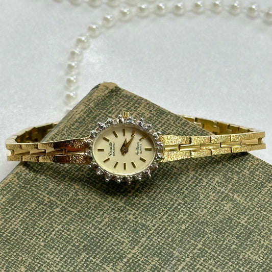 Dainty vintage gold tone diamanté Deauville Diamond Armitron watch with quartz movement.