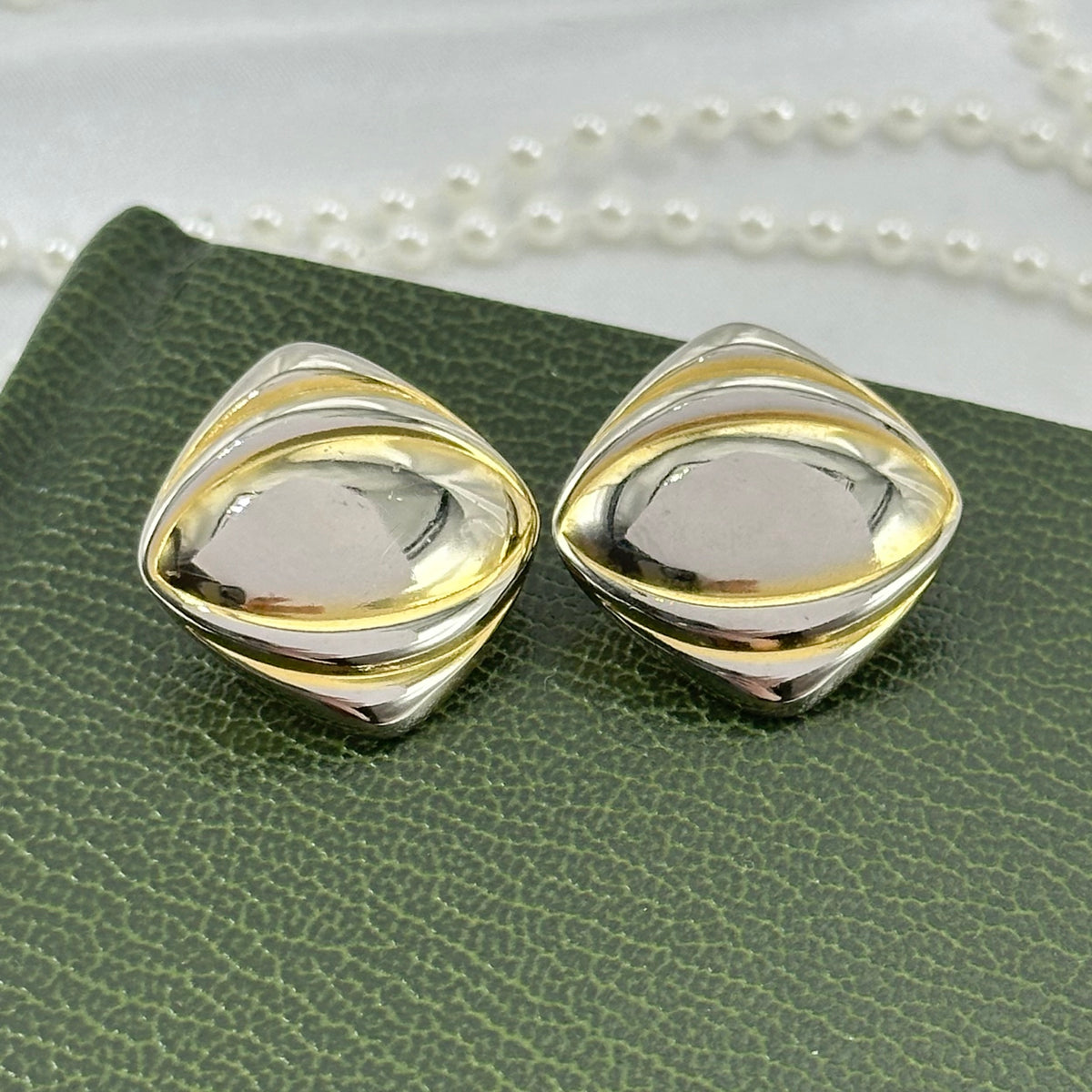 Vintage chunky gold tone diamond shaped clip on earrings.