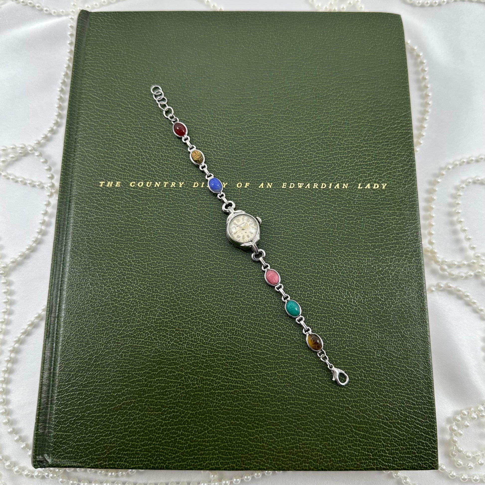 Vintage 10k gold filled Hamilton manual winding cocktail watch with multicolor scarab band.