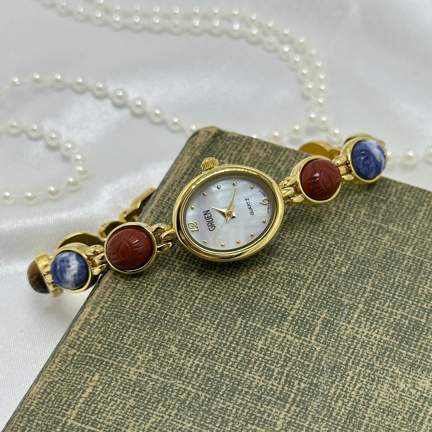 Gold Gruen Scarab Watch with Mother of Pearl Dial