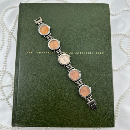 Vintage silver tone Zapp watch with 1986 &amp; 1987 penny coin link band and roman numeral markers.&nbsp;