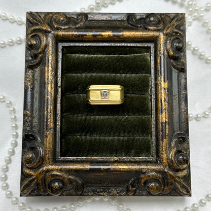 Matte gold electroplated vintage deadstock ring with solitaire clear stone.
