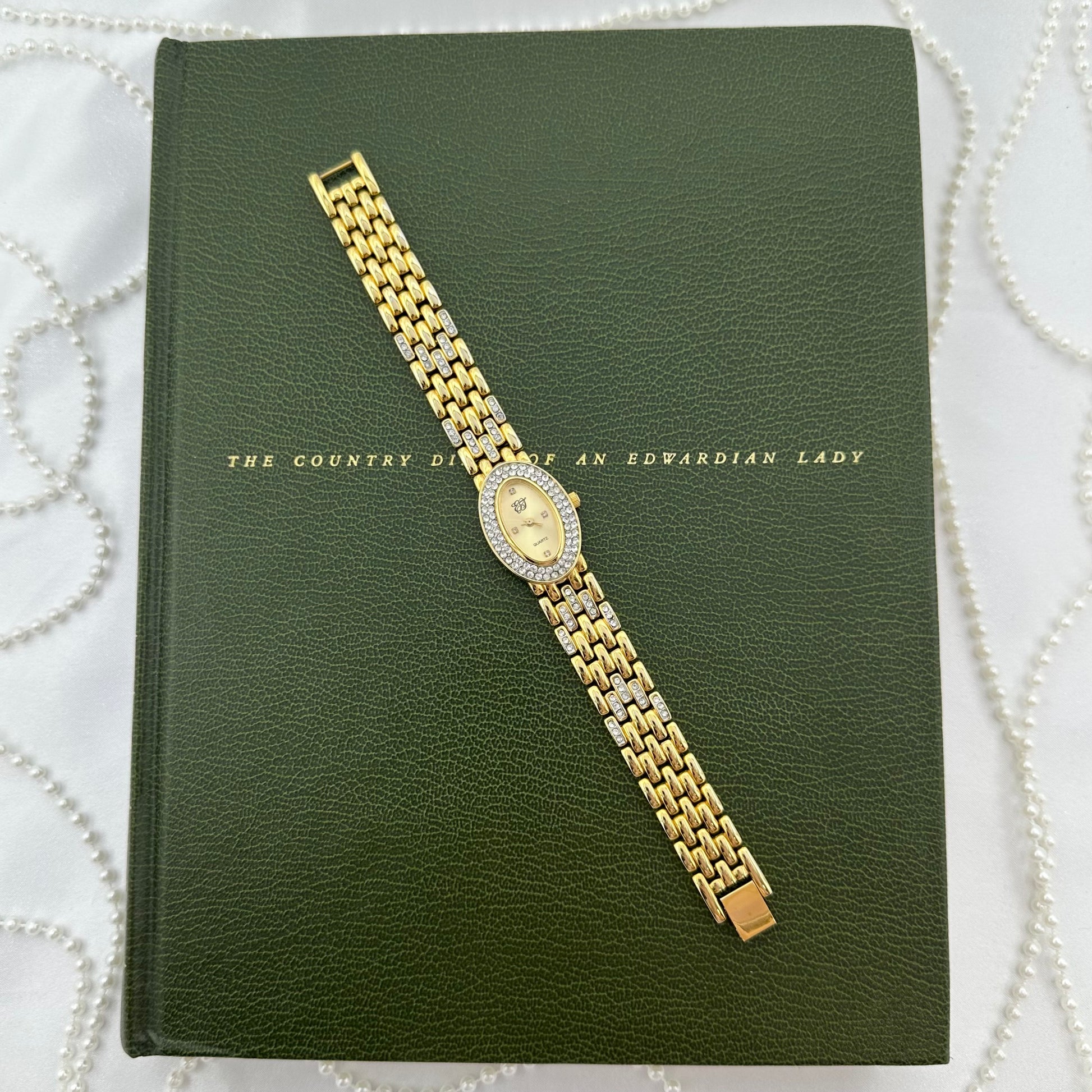Elizabeth Taylor White Diamanté Gold Watch with Oval Dial