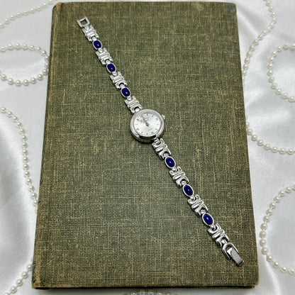Silver Round Dial Watch with Blue Gemstone Band