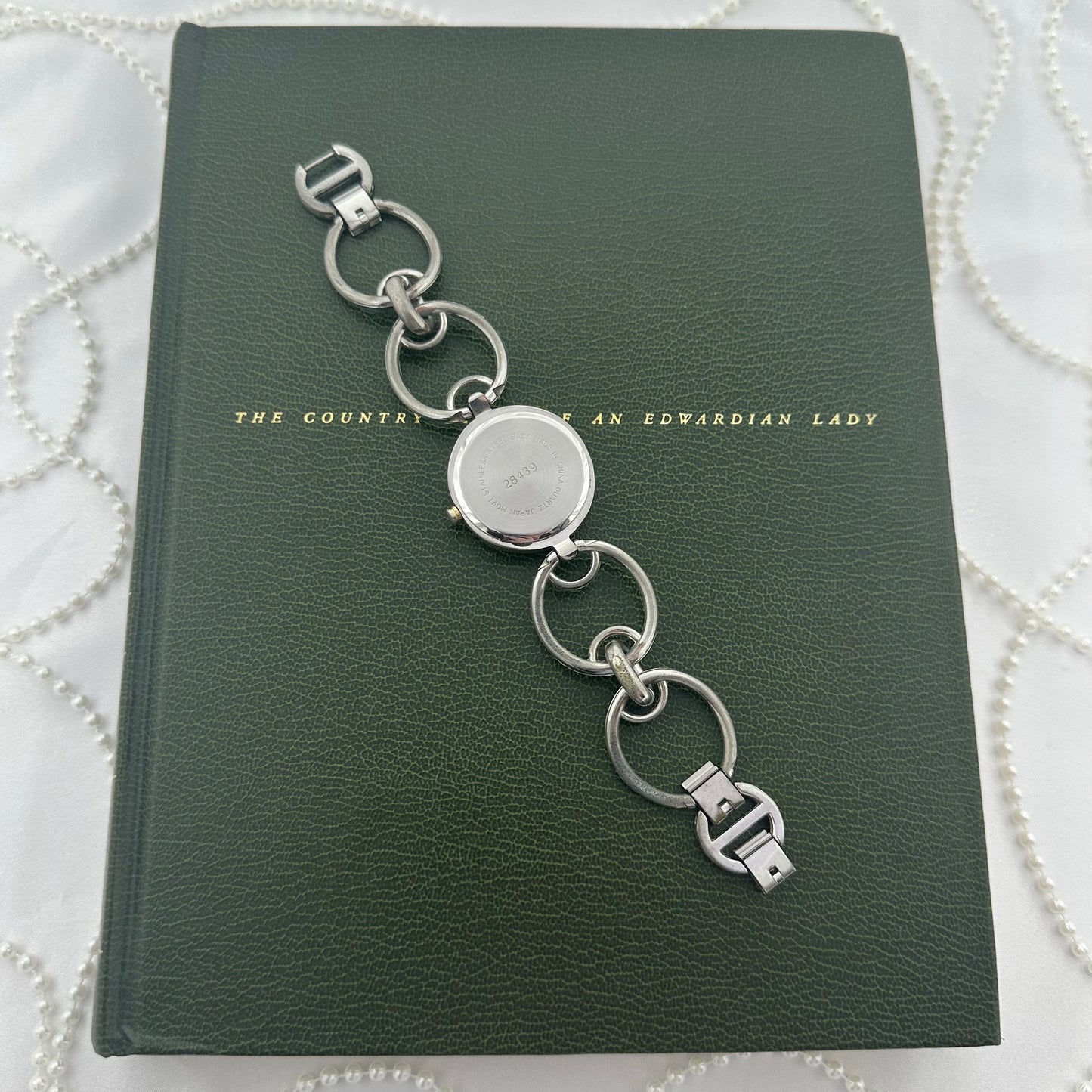 Round Dial Silver Minicci Watch with Gold Hands and Circle Links