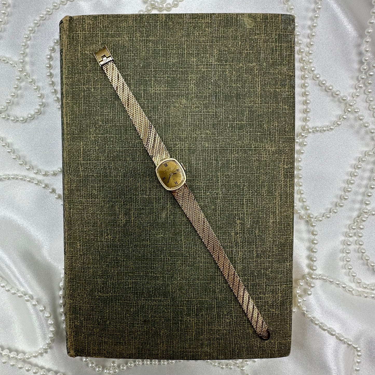 Slender Gold Vintage Wind-Up Elgin Watch with Roman Numeral Markers