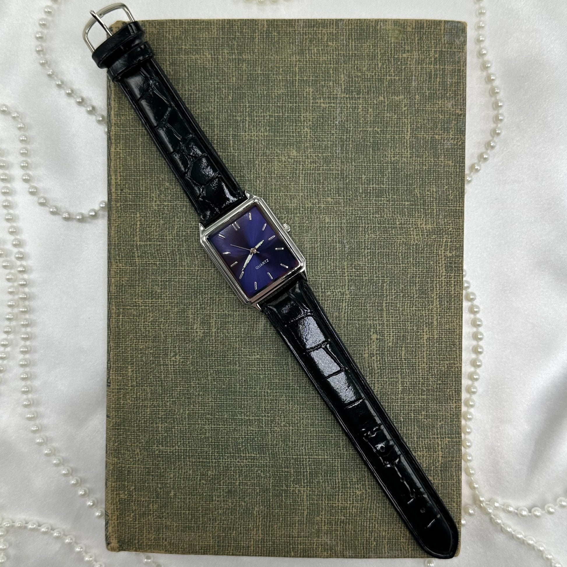 Black wristwatch with a rectangular face