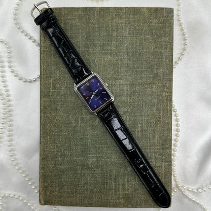 Black wristwatch with a rectangular face