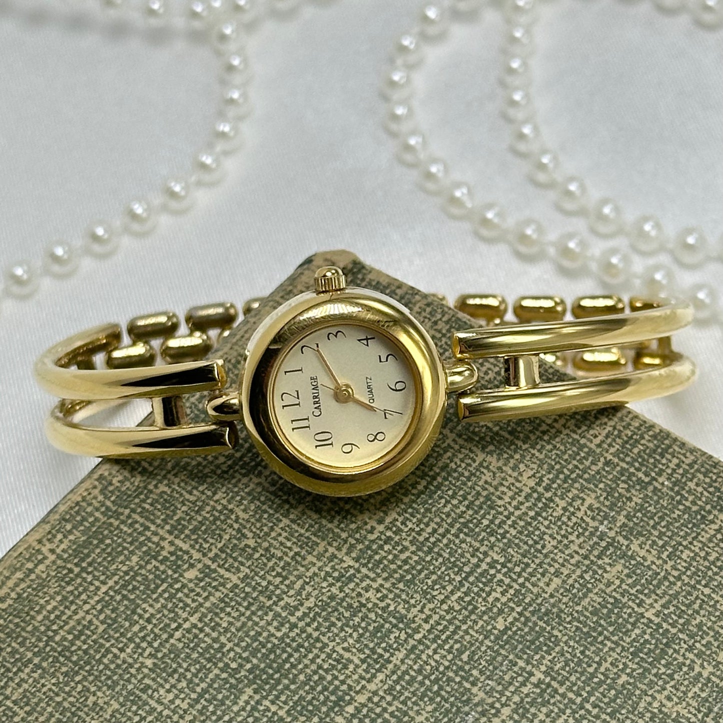 Gold Carriage Cuff Watch