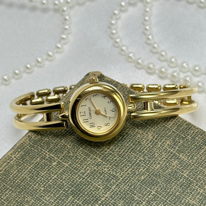 Gold Carriage Cuff Watch