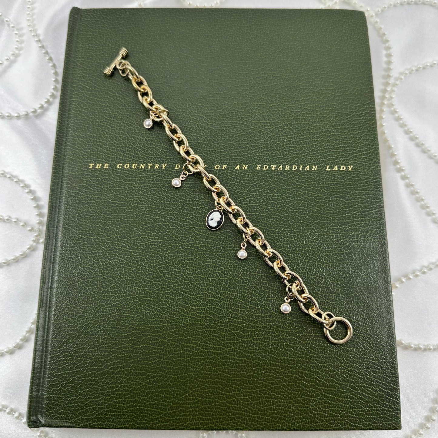 Gold Pearls and Black Cameo Charm Bracelet