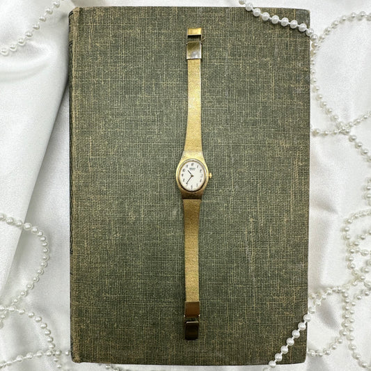 Gold Tone Seiko round dial watch with Quartz Movement.