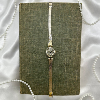 Gold and silver tone diamanté cross watch
