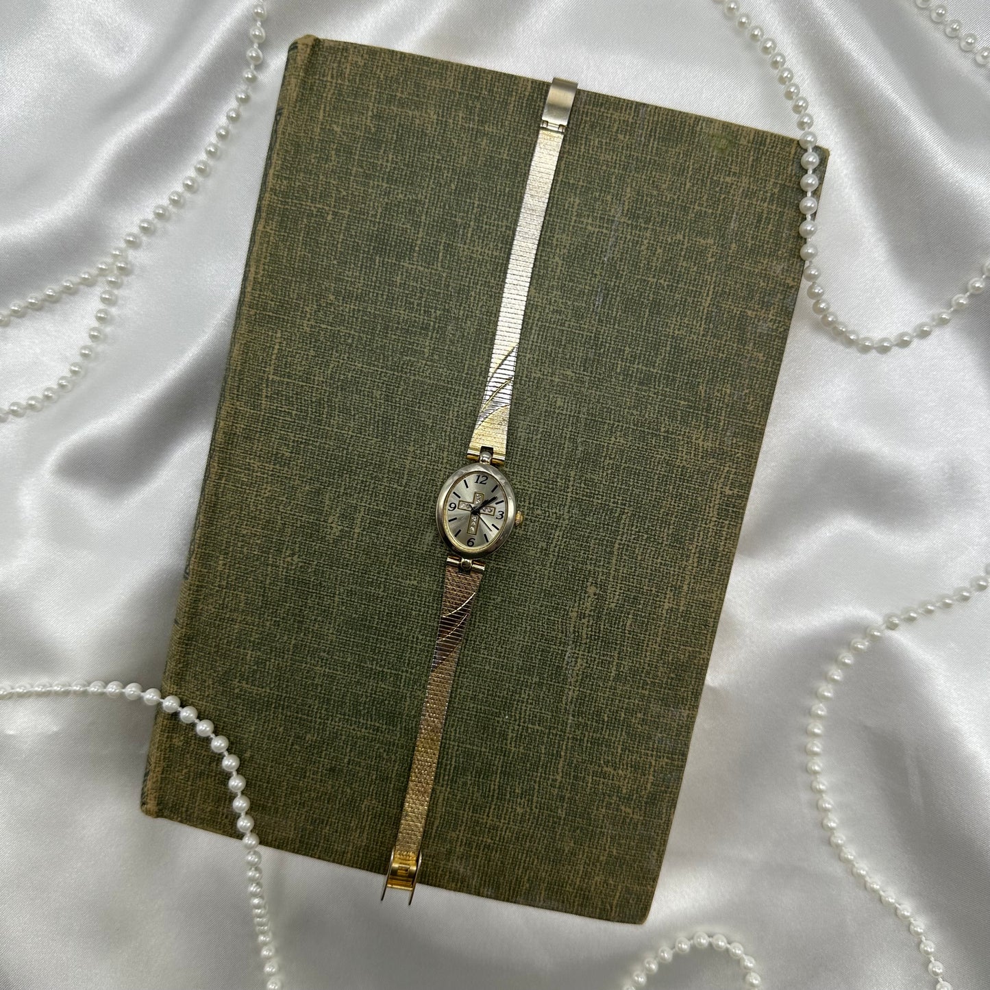 Gold and silver tone diamanté cross watch with quartz movement