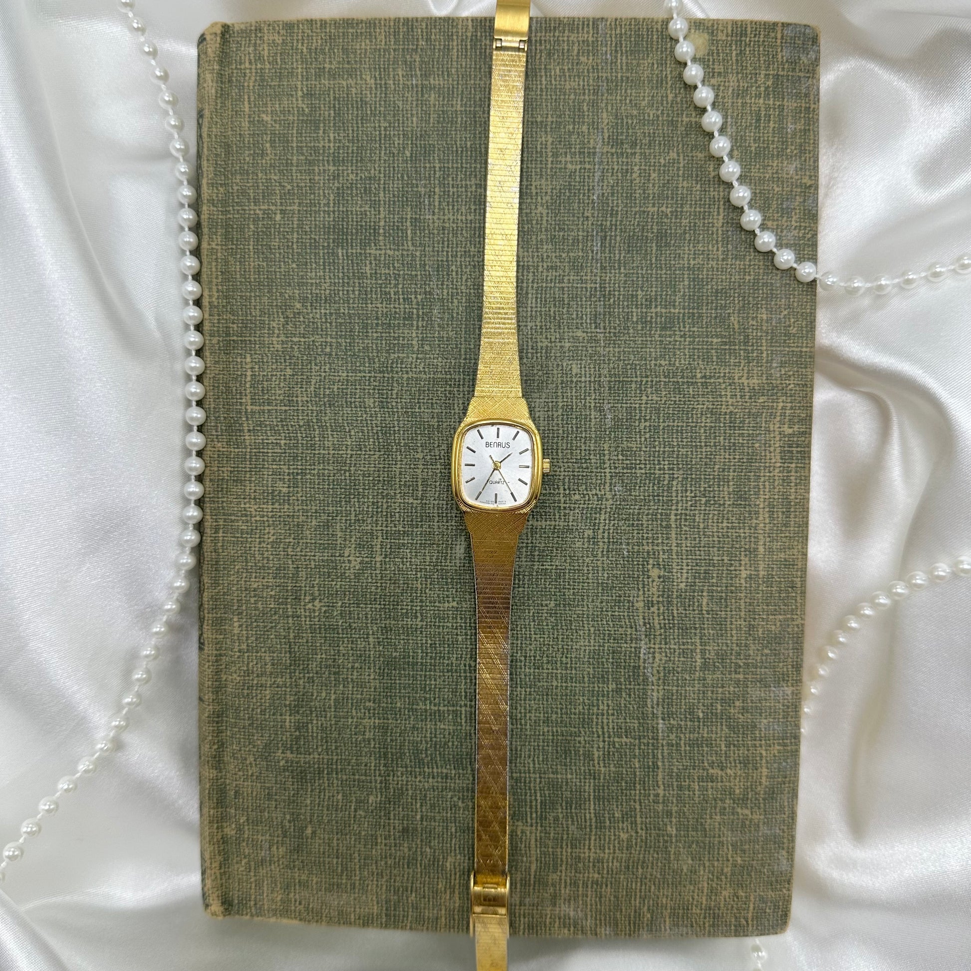 Gold tone Benrus watch with square dial and quartz movement