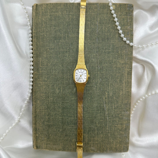 Gold tone Benrus watch with square dial and quartz movement