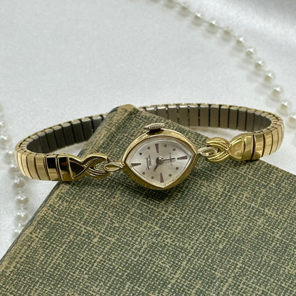 Gold tone Germinal Voltaire 17 jewels manual winding watch with stretchable band