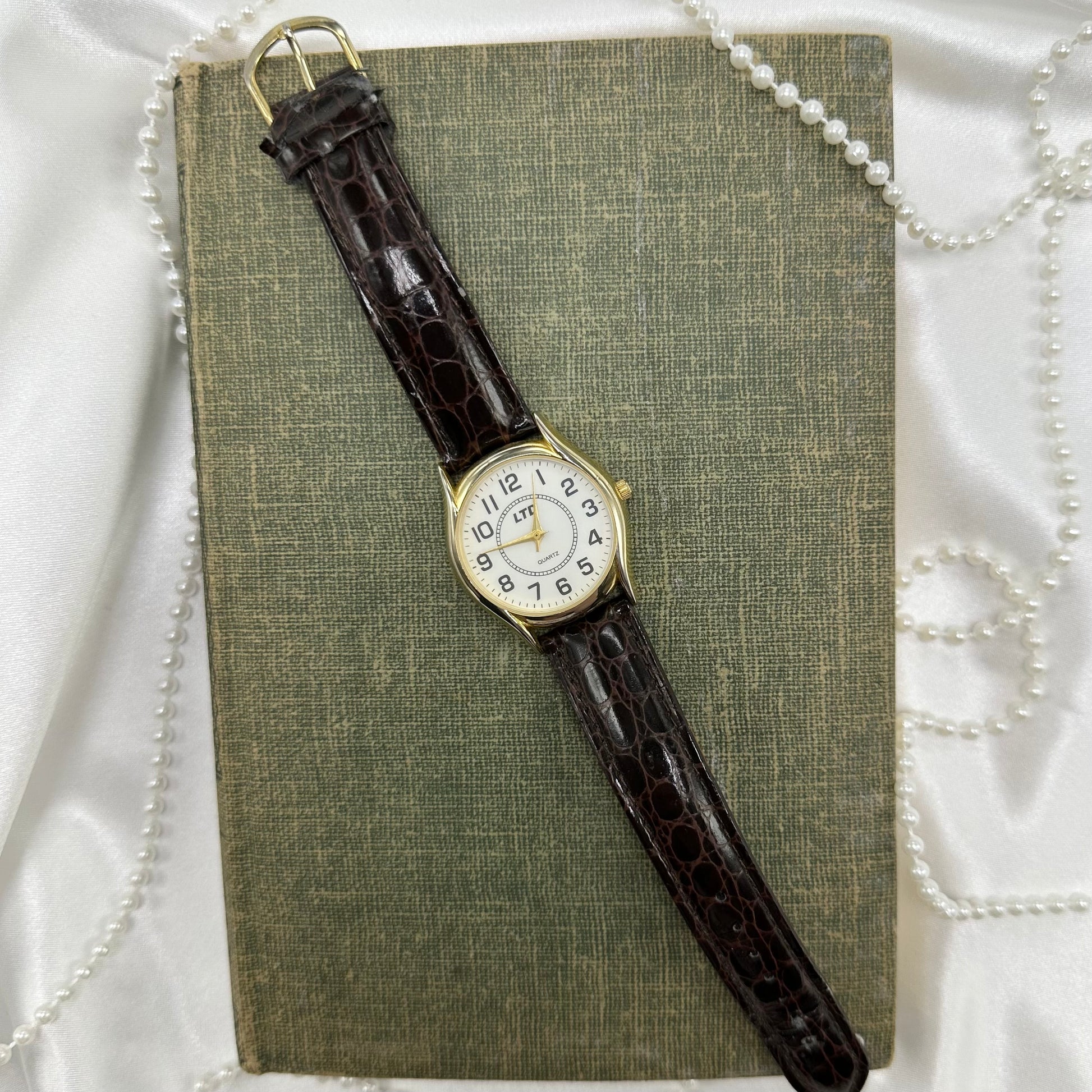 Gold tone LTD round dial watch with quartz movement