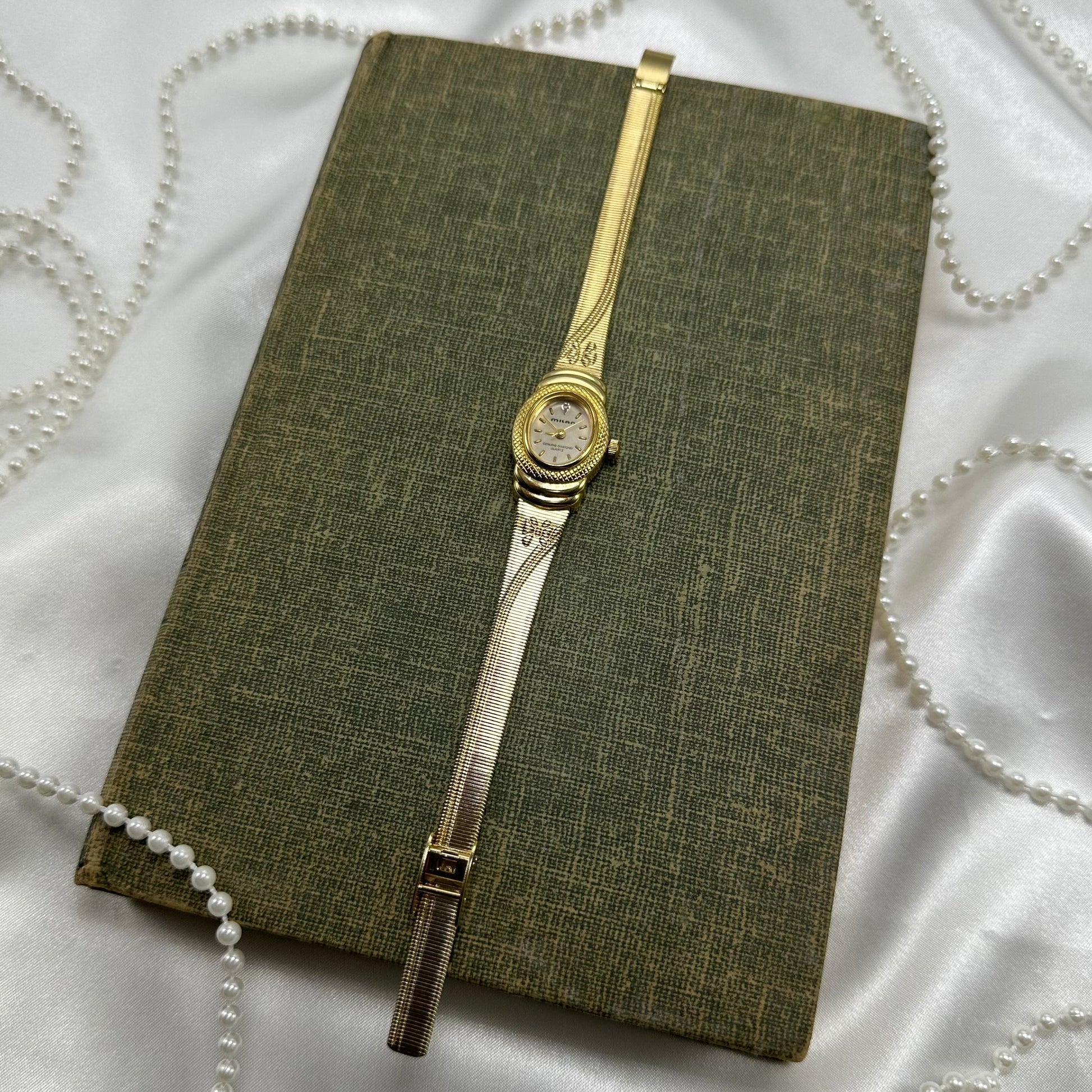 Gold tone Milan watch with cute bows on the band