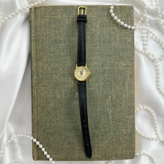 Gold tone Timex round dial watch with quartz movement