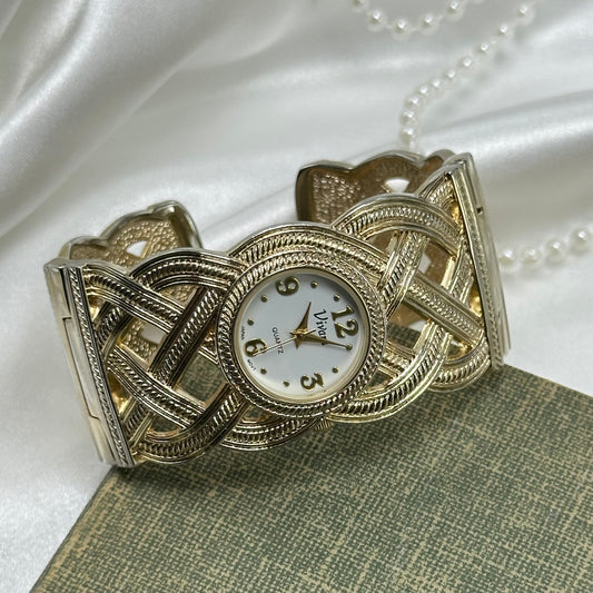 Gold tone Vivan cuff watch with quartz movement