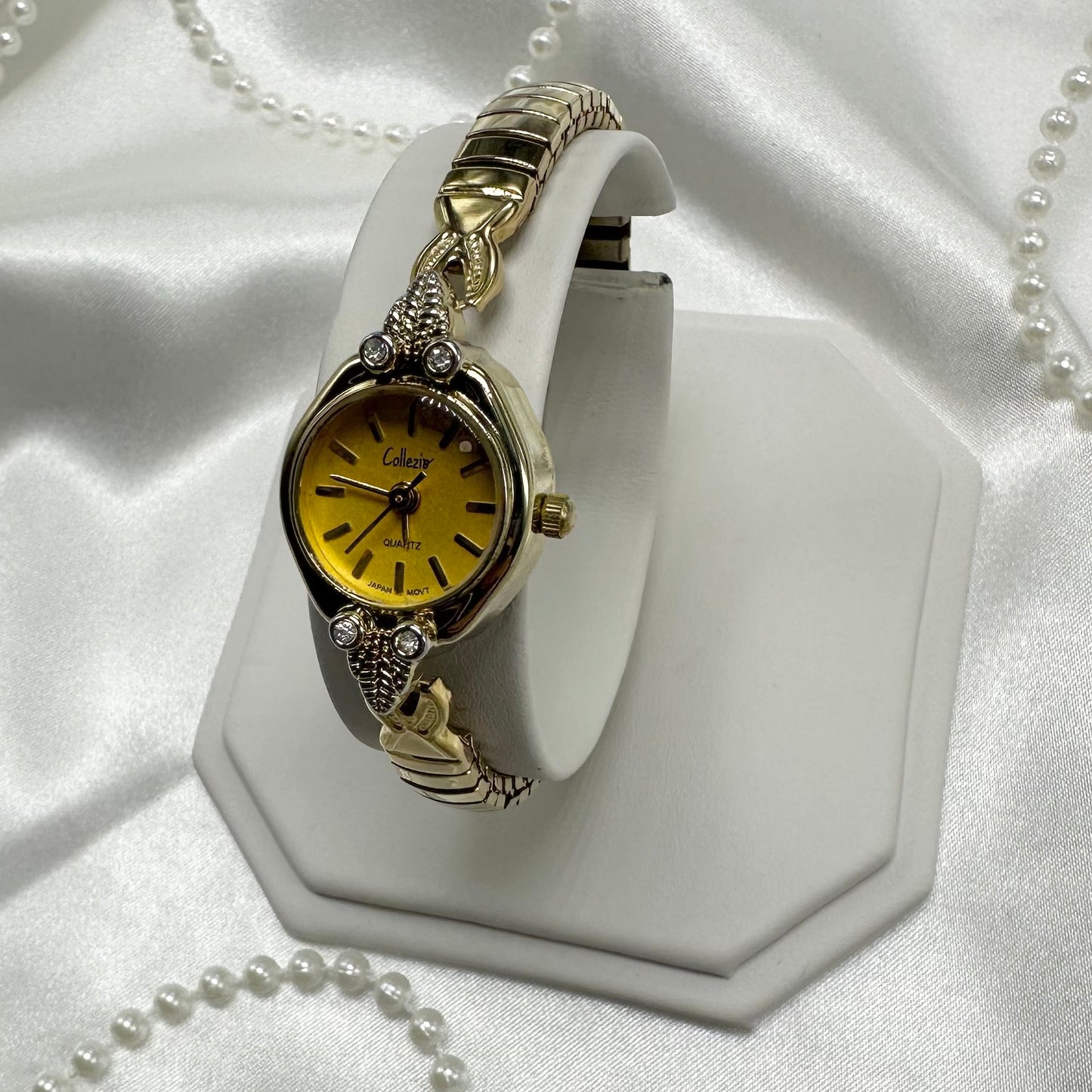 Gold tone diamanté Collezio watch with quartz movement.