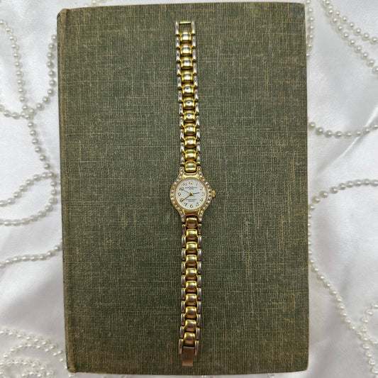 Gold tone diamanté LA Express watch with quartz movement.
