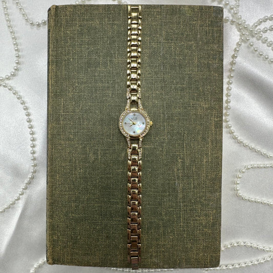 Gold tone diamanté Luxe Diamond watch with mother of pearl dial and quartz movement.