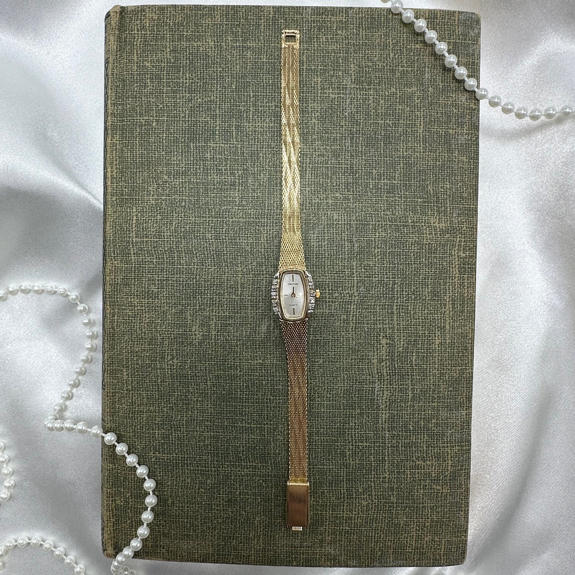 Gold tone diamanté Waltham watch with quartz movement.