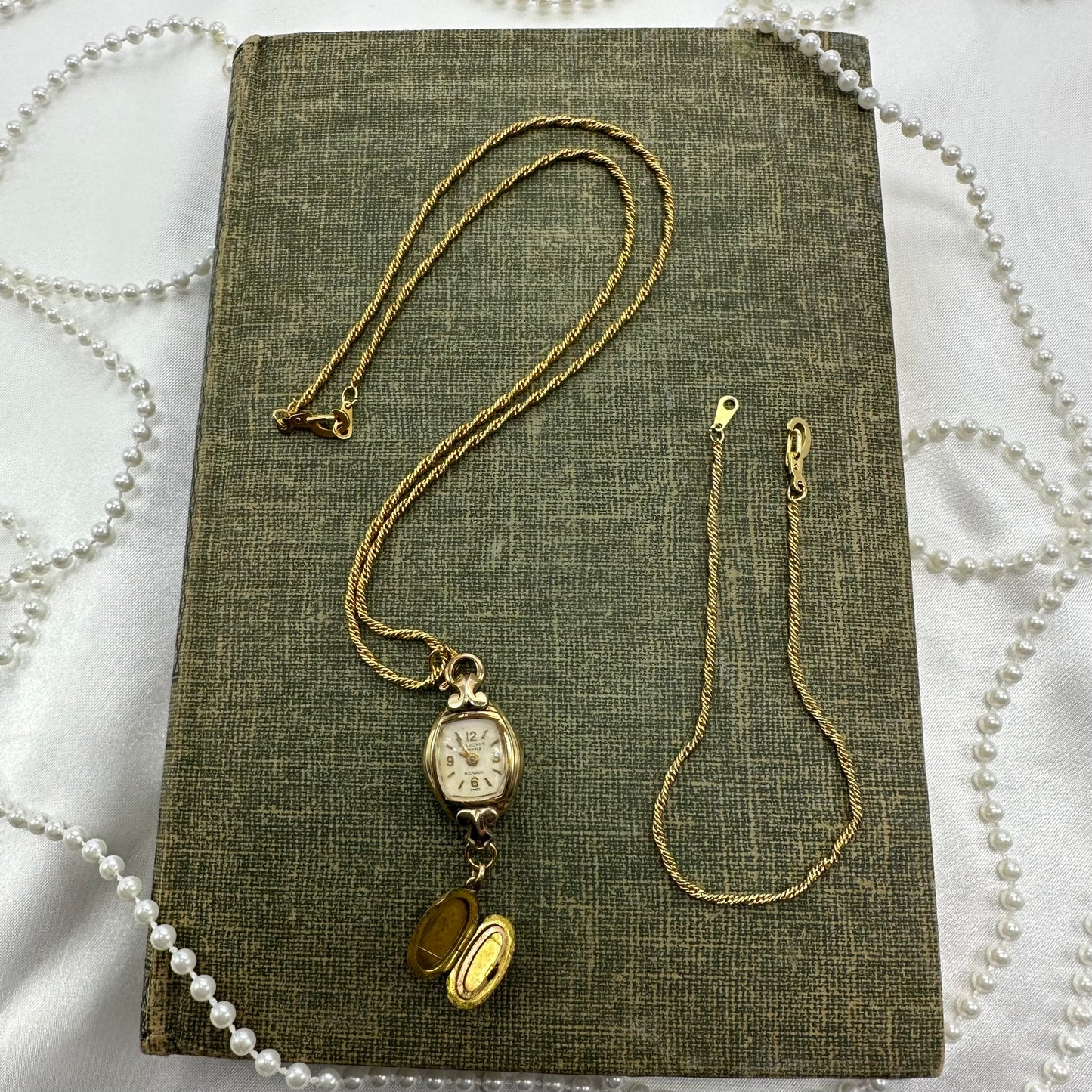 Gold tone necklace with vintage 10k RGP watch and oval locket pendant. Matching bracelet.
