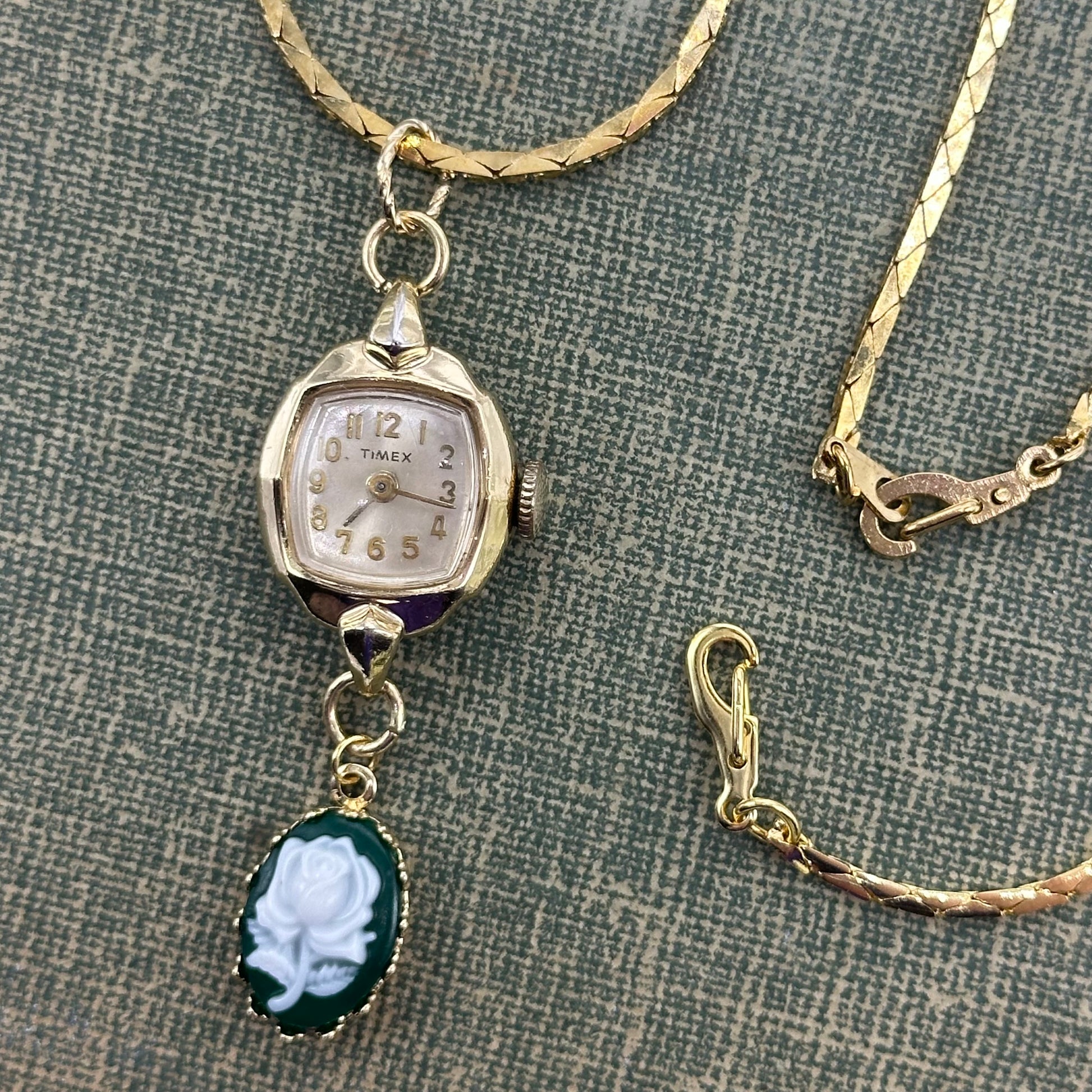 Gold tone necklace with vintage Timex watch and green rose cameo pendant 