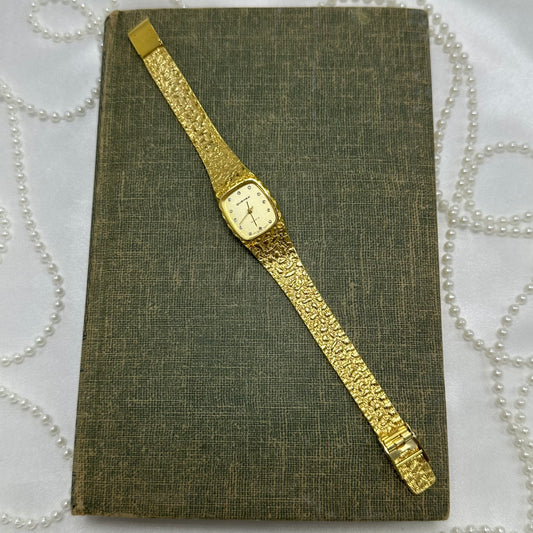Gold tone nugget Quemex watch with diamanté stone markers and quartz movement. No crown.