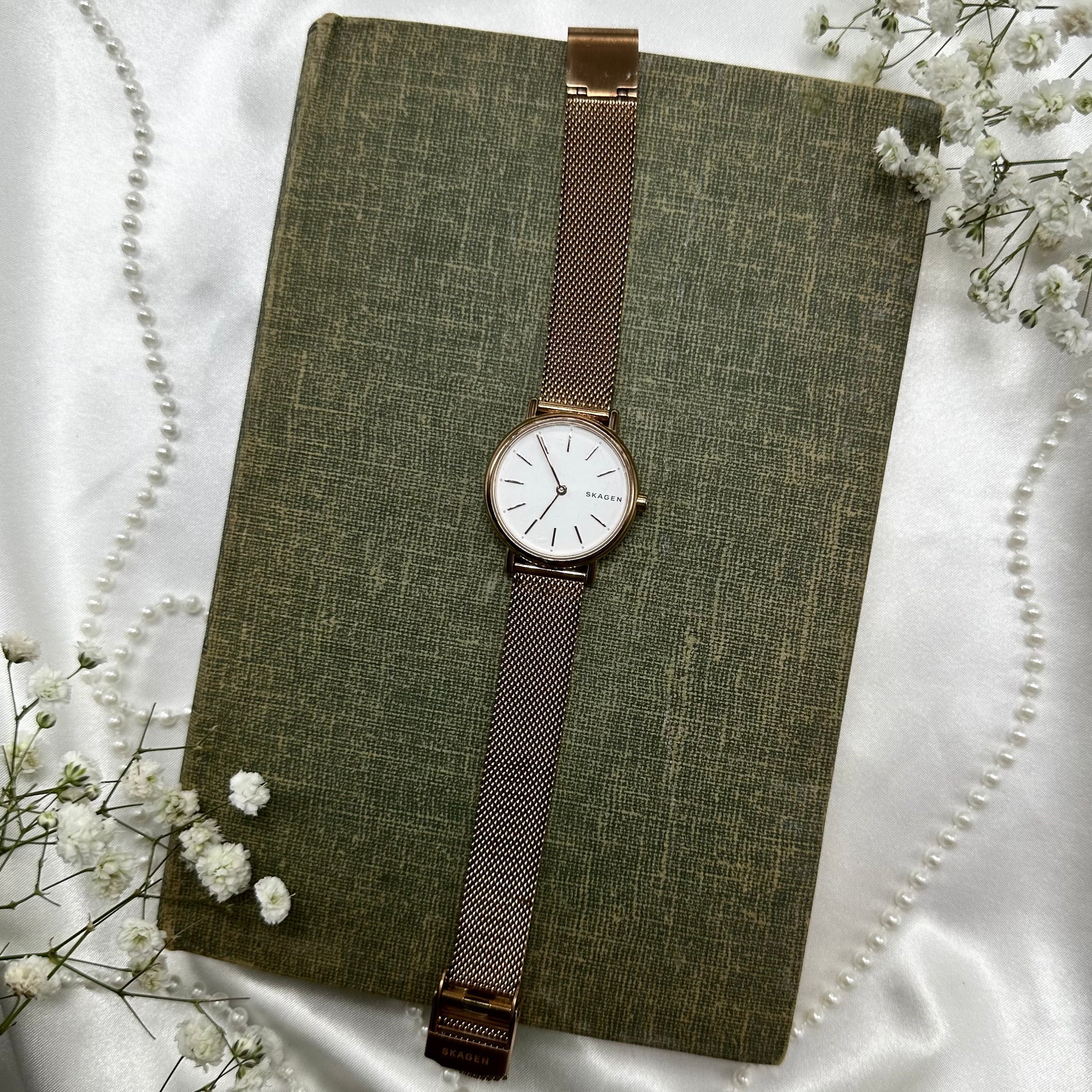 Rose gold tone Skagen watch with clasp band