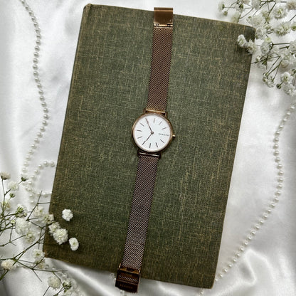 Rose gold tone Skagen watch with clasp band