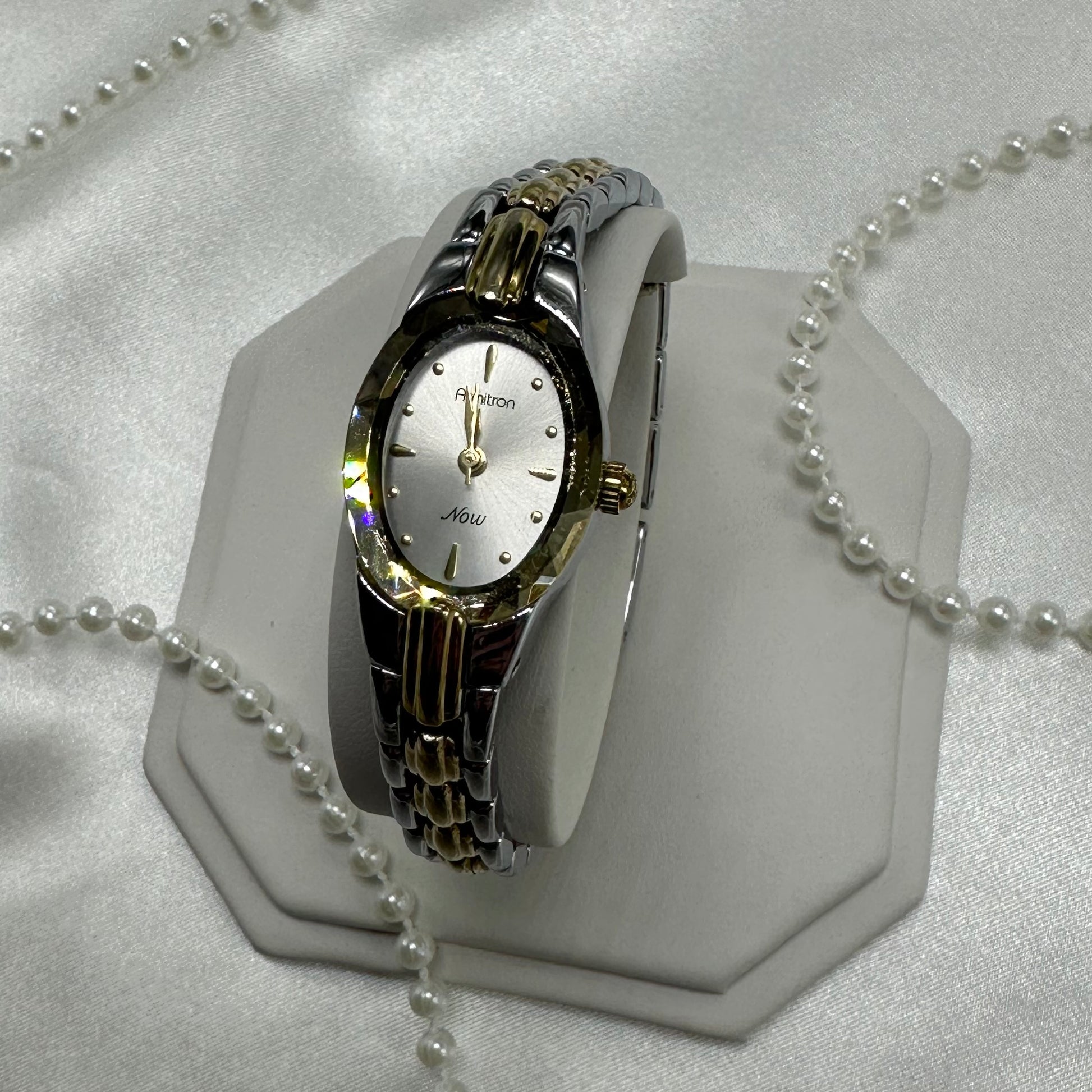 Silver and gold tone Armitron watch with crystal bezel