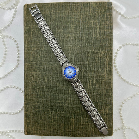 Silver tone Collezie watch with bright blue/white dial and quartz movement.