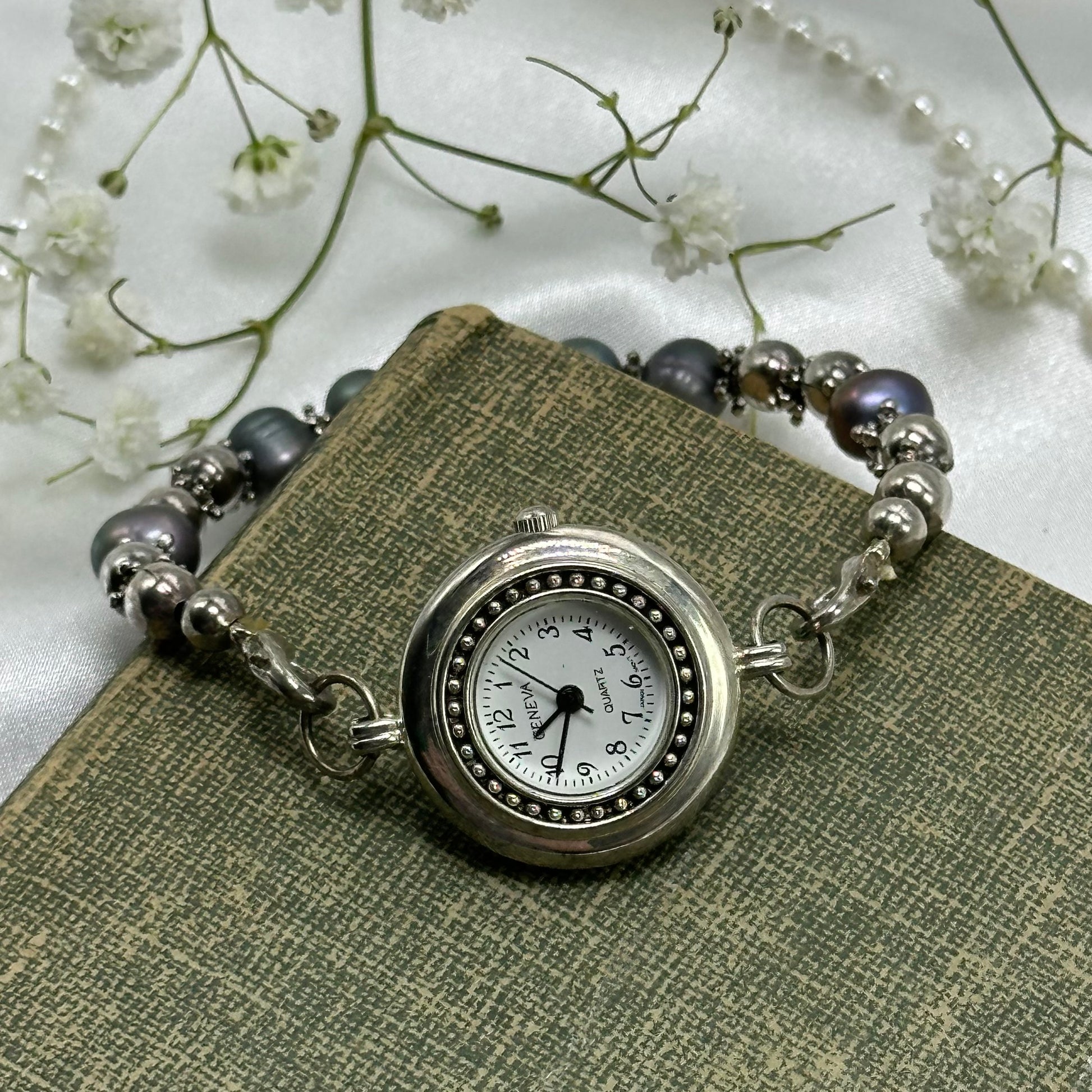 Silver tone Geneva watch with quartz movement