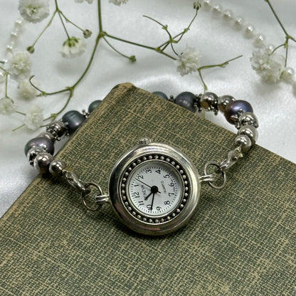 Silver tone Geneva watch with quartz movement