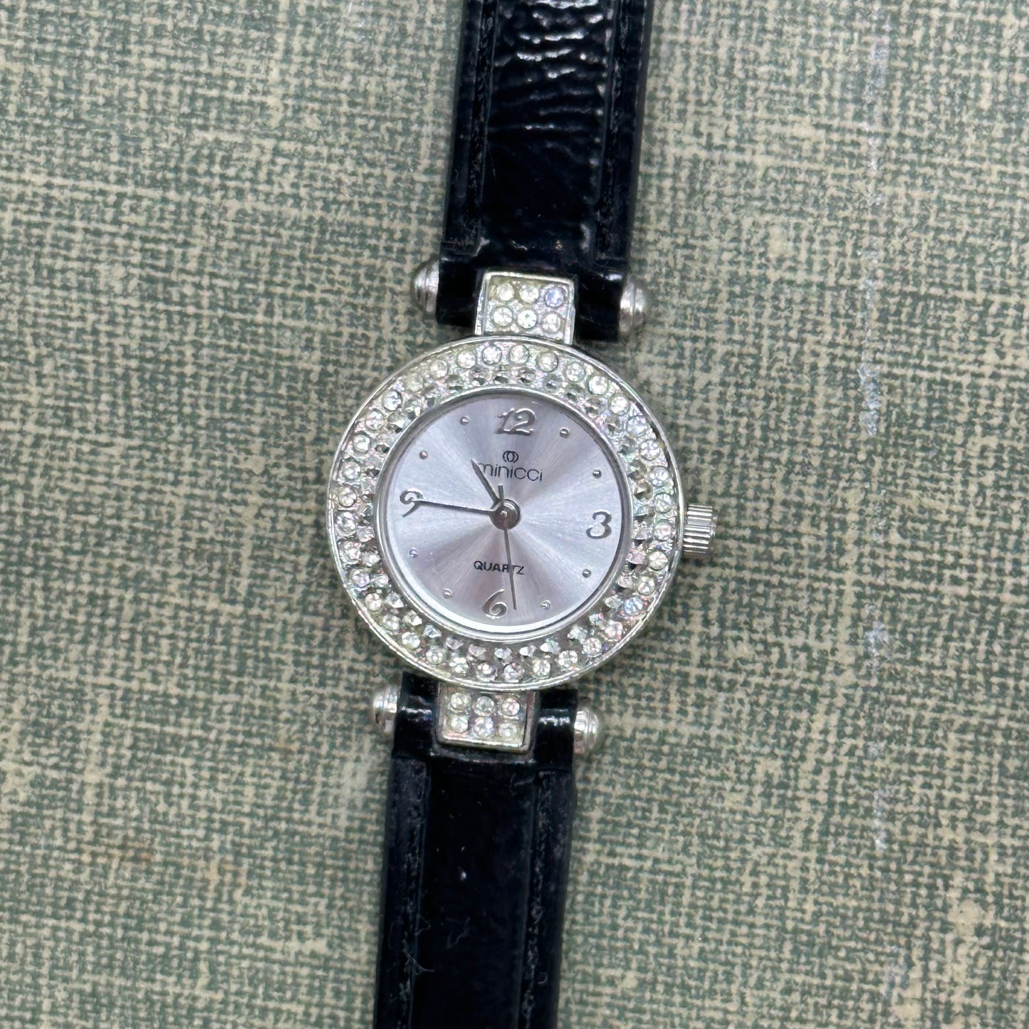 Silver tone diamanté Minicci watch with quartz movement.