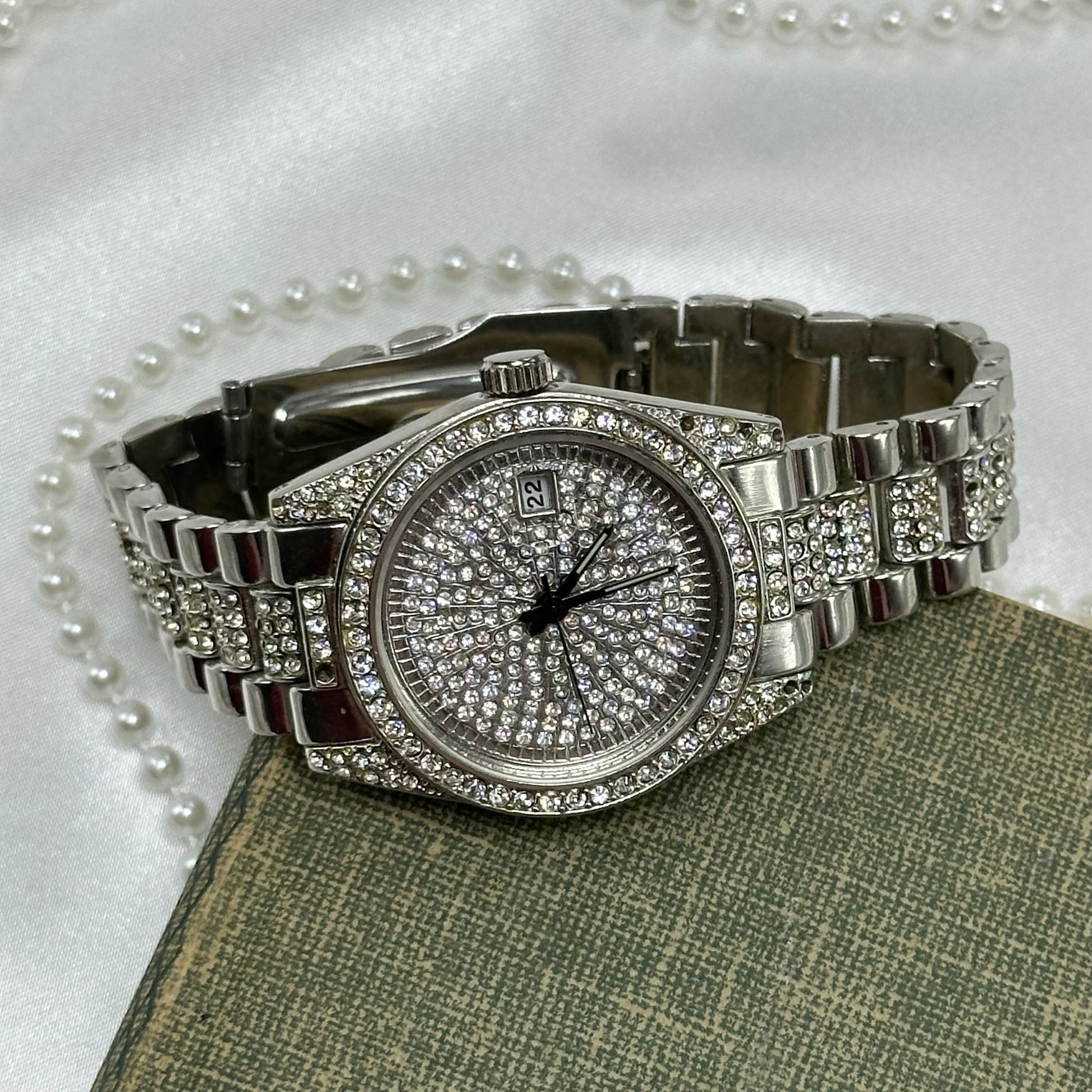 Silver tone diamanté watch with date display and quartz movement