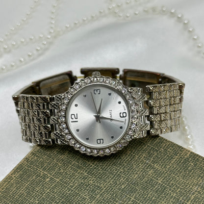 Silver tone diamanté watch with stretchy band.