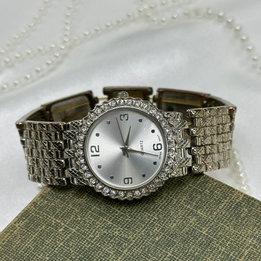 Silver tone diamanté watch with stretchy band.