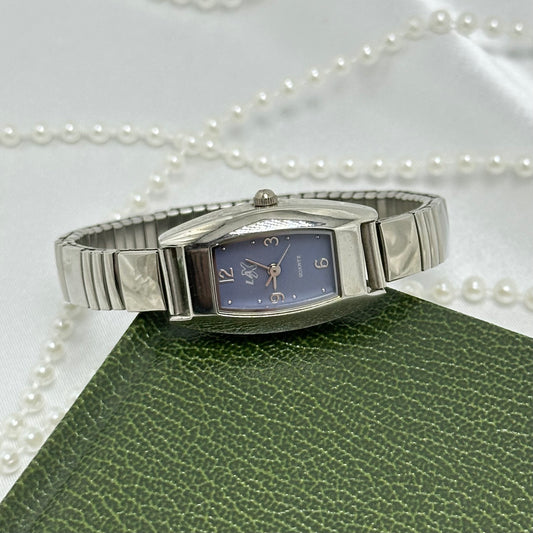 Silver tone light blue dial LA Express watch with stretchable band.