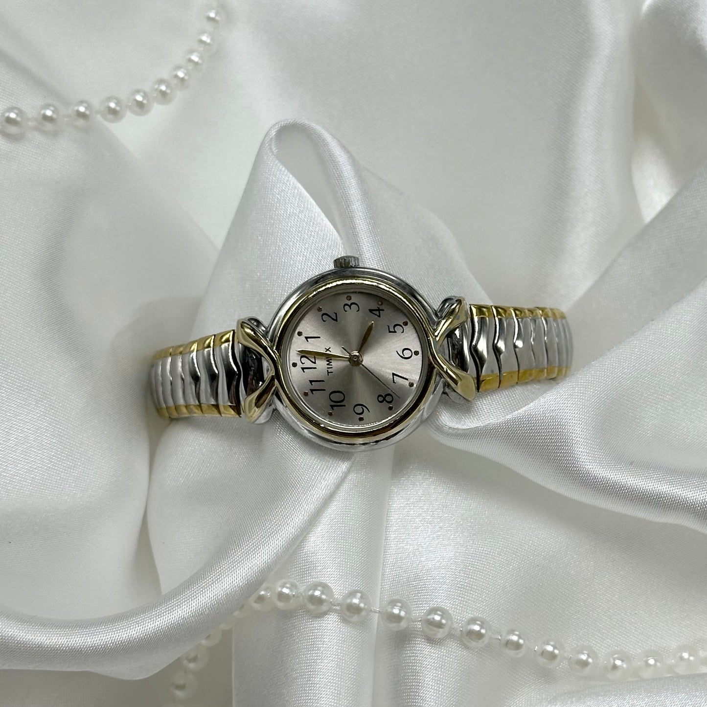 Two-Tone Classic Timex watch with stretchable band.&nbsp;