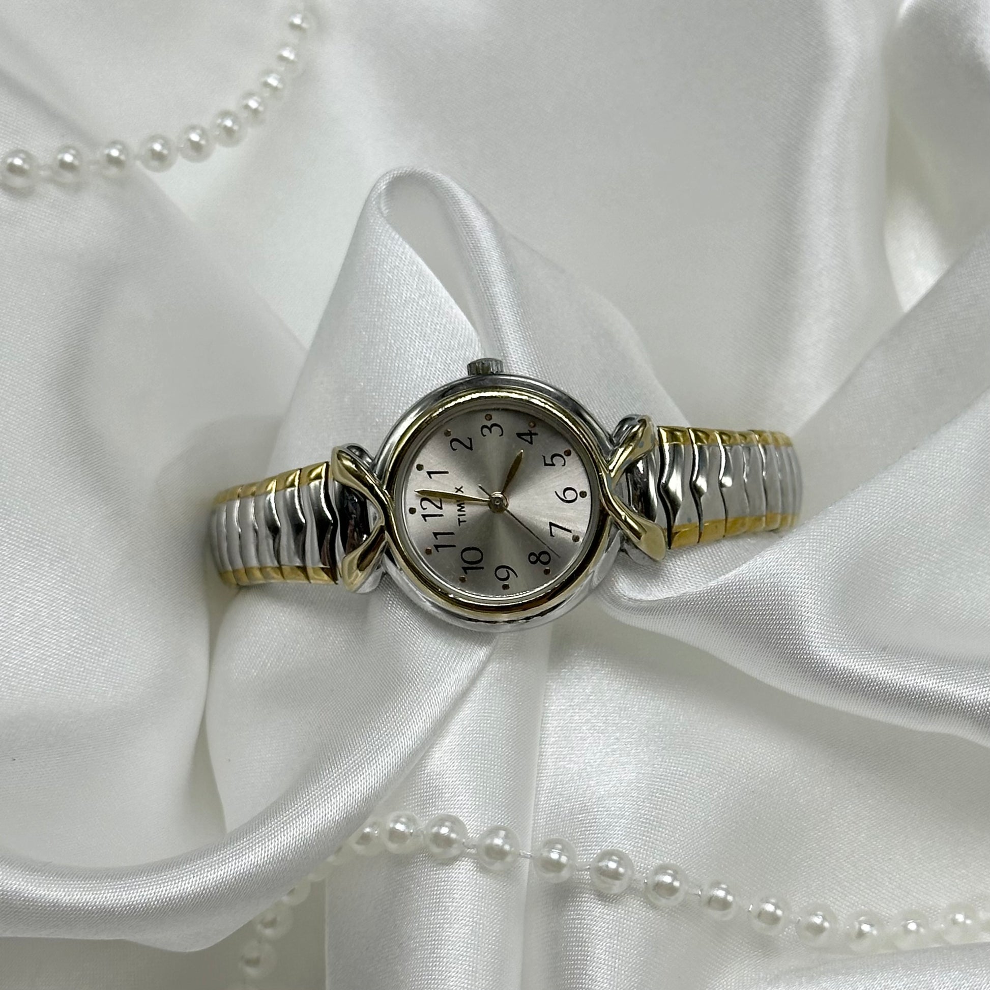 Two-Tone Classic Timex watch with stretchable band.&nbsp;