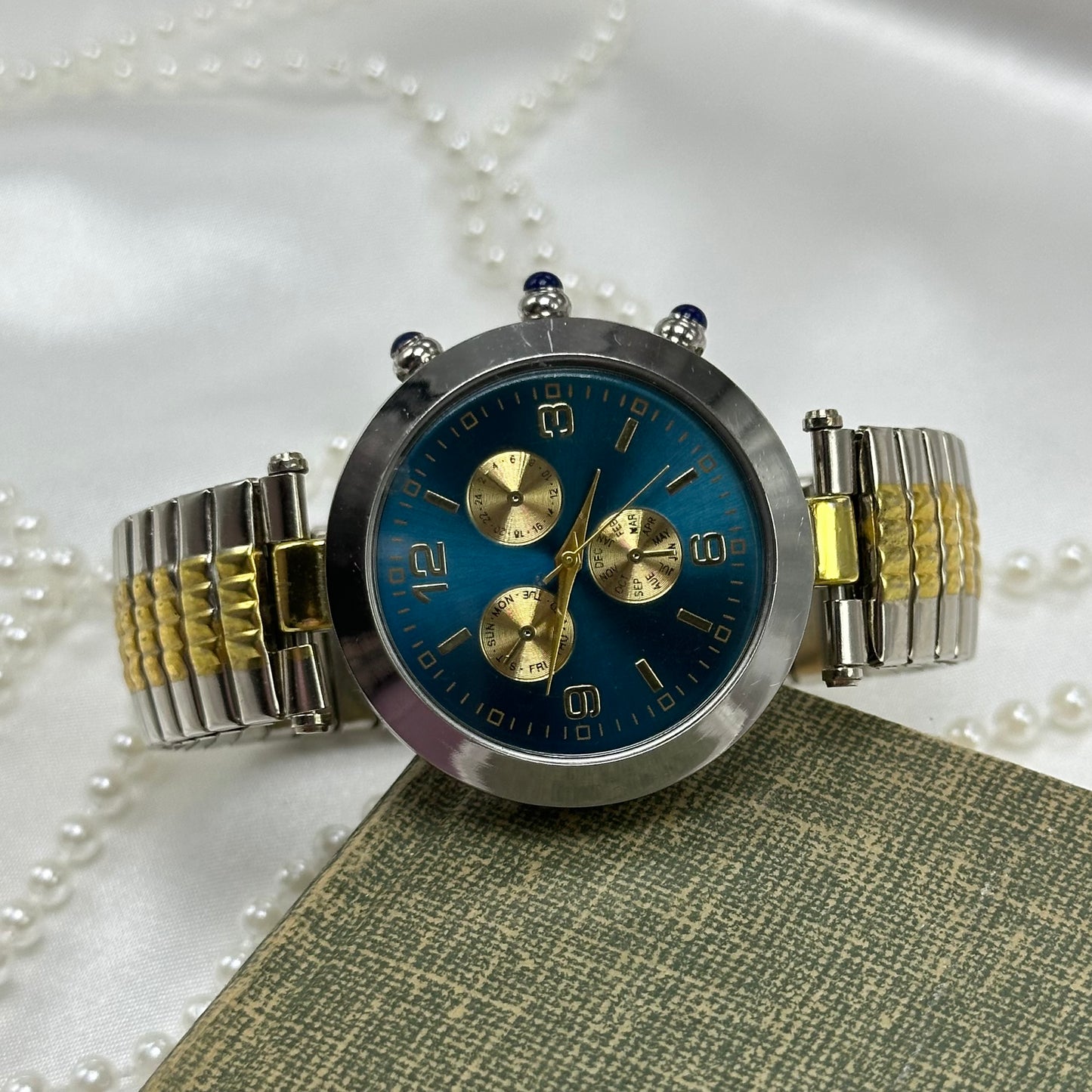 Unique Blair silver and gold tone chronograph watch with blue dial and stretchable band.