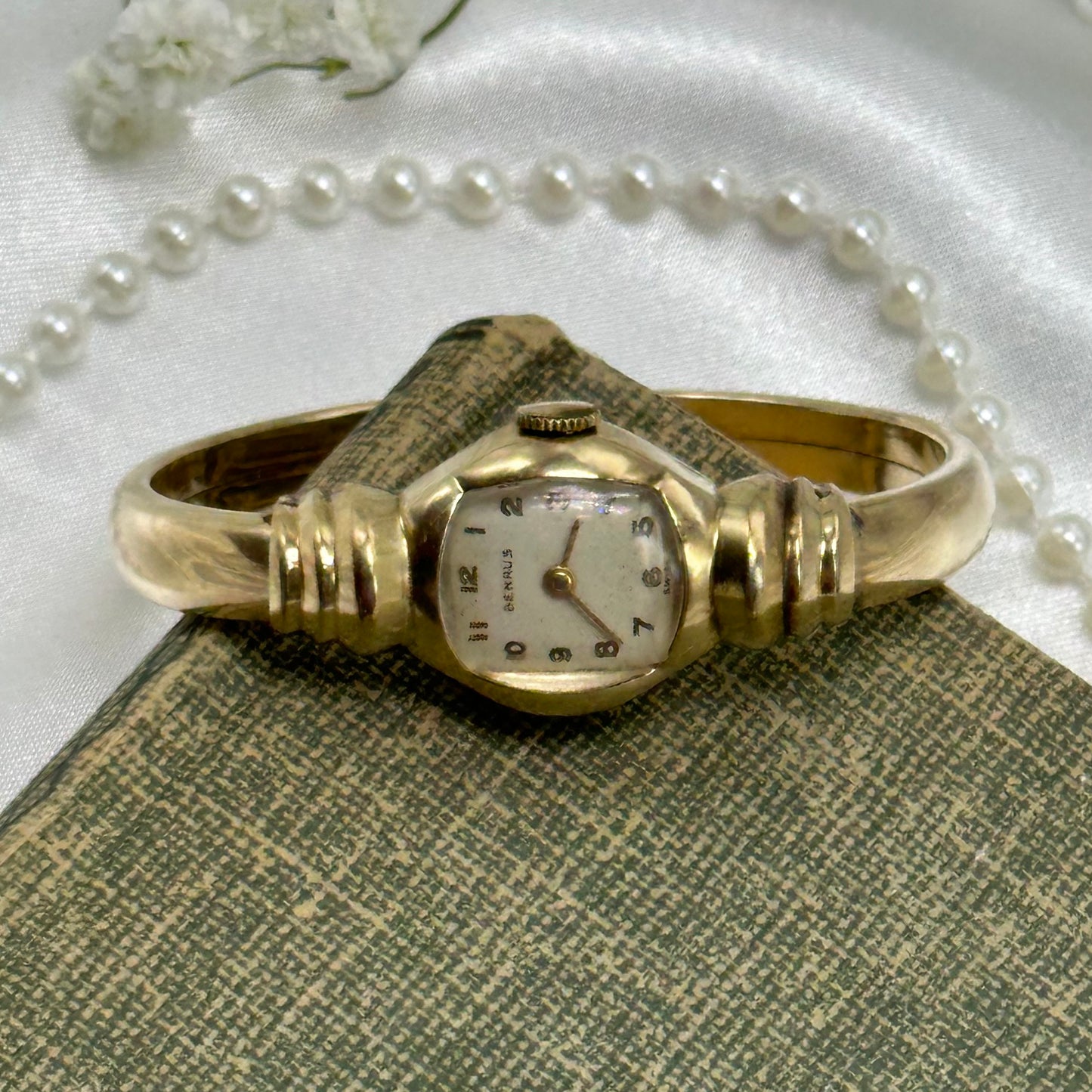 Vintage 10k gold filled Benrus Swiss manual winding cuff watch with unique safety clasp.